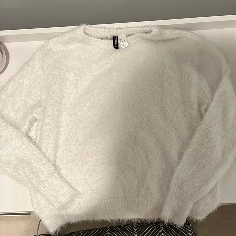 white fuzzy sweater